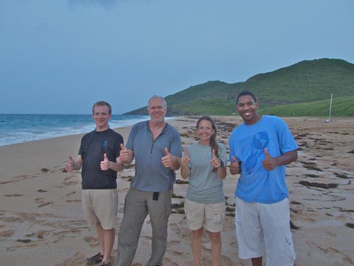 A band of happy (and tired) sea turtle researchers give thumbs up after a night of successful monitoring.